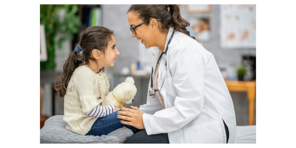 Pediatrician talks one-on-one with a child.